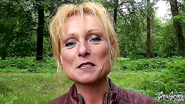 Mature blonde woman, Mendy is having casual sex in the nature, with a group of horny guys