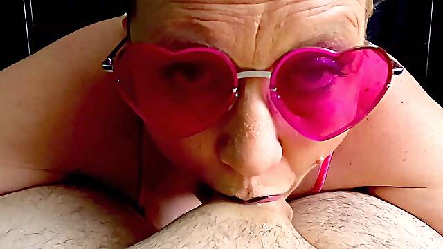 Cougar wanks a cock with Her Throat