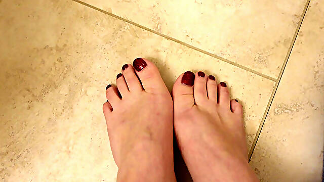Quick New Pedicure Show off Glittery Red Toenails